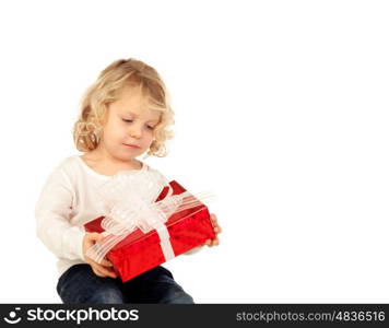 Small blond child with a red present isolate on a white background