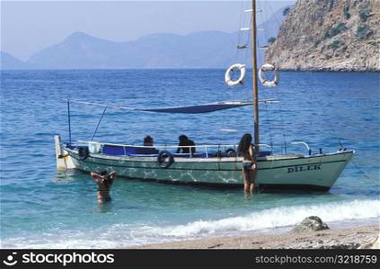 Small Boat Anchored on Pristine Beach