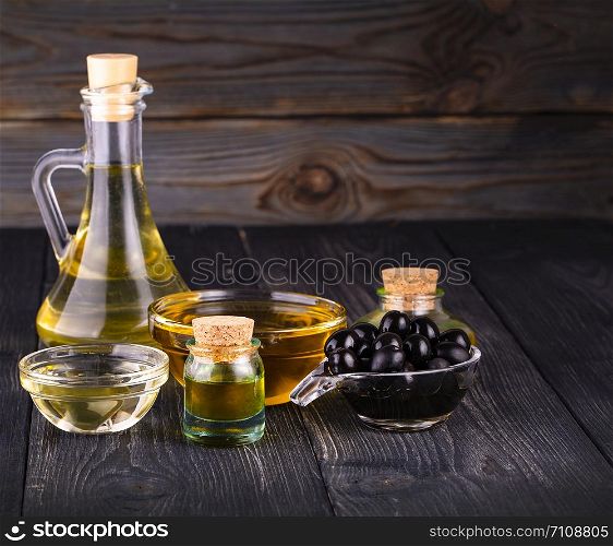 small bowl and bottle with olive oil. The small bowl and bottle with olive oi