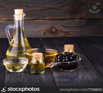 small bowl and bottle with olive oil. The small bowl and bottle with olive oi