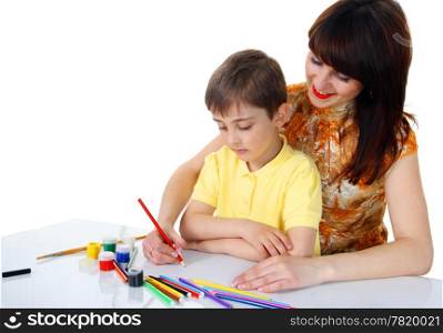 small boy and a young girl with colored pencils on the white background