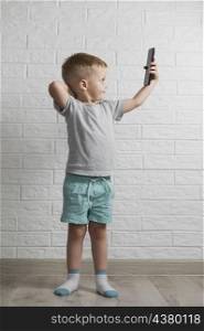 small boy using phone mock up