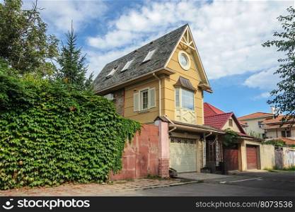 Small brick private two-storied residential house in Odessa, Ukraine. Sunny summer day