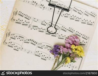 small bright flowers branches music sheet