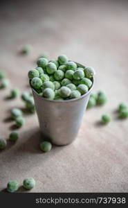 Small bucket with frozen peas.. Small bucket with frozen young green peas