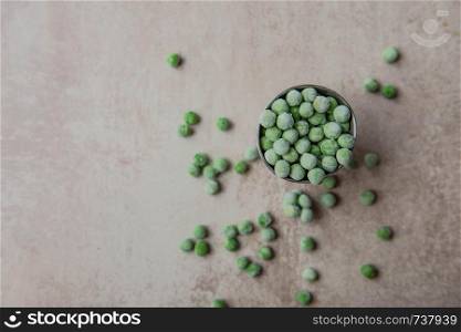 Small bucket with frozen peas.. Small bucket with frozen young green peas