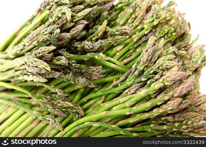 Small bundles of Mexican Asparagus over white.