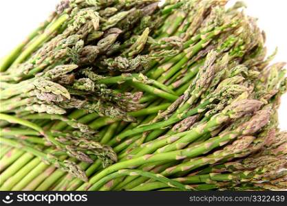 Small bundles of Mexican Asparagus over white.