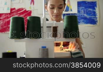 Small business and self-employed women, young hispanic woman working as fashion designer with sewing machine in studio. Sequence