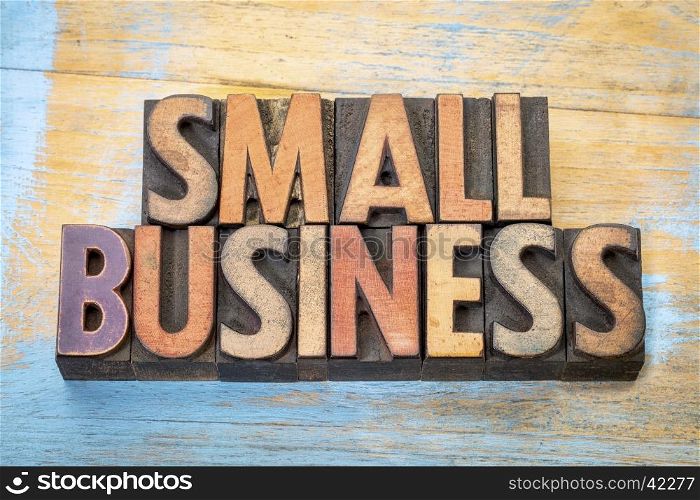 small business banner in vintage letterpress wood type blocks stained by color inks