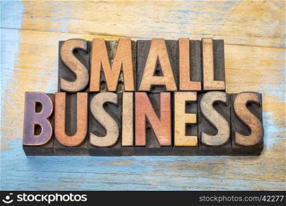 small business banner in vintage letterpress wood type blocks stained by color inks