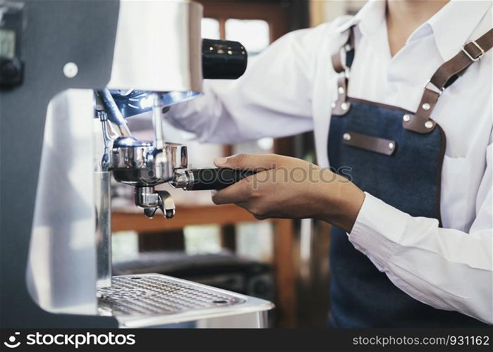 Small business coffee cafe owner at work. Barista coffee cafe making coffee preparation service.
