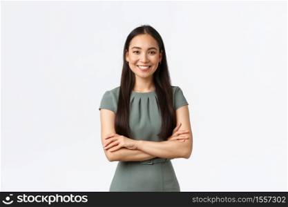 Small business owners, women entrepreneurs concept. Confident young asian woman starting startup, managing online store and work from home, standing confident with arms crossed, smiling pleased.. Small business owners, women entrepreneurs concept. Confident young asian woman starting startup, managing online store and work from home, standing confident with arms crossed, smiling pleased