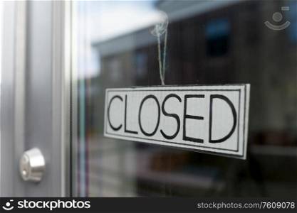 small business, pandemic and service concept - glass door of closed shop or office. glass door of closed shop or office