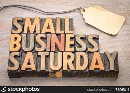 Small Business Saturday word abstract - text in vintage letterpress wood type with a blank price tag, holiday shopping concept