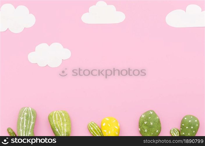small cactuses with paper clouds table. Resolution and high quality beautiful photo. small cactuses with paper clouds table. High quality and resolution beautiful photo concept