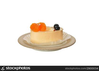 Small cake with white icing and tangerines isolated