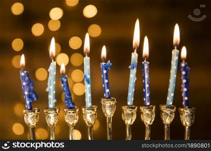 small candles menorah near abstract lights. Resolution and high quality beautiful photo. small candles menorah near abstract lights. High quality and resolution beautiful photo concept