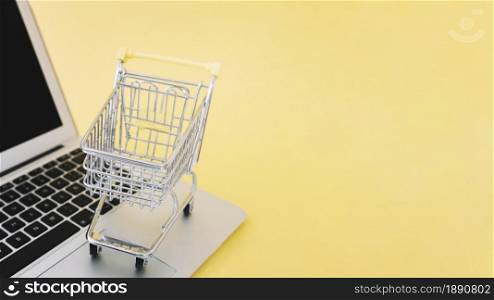 small cart on laptop. Resolution and high quality beautiful photo. small cart on laptop. High quality and resolution beautiful photo concept
