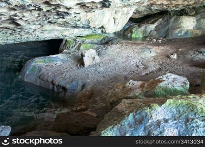 Small cave (Crimea, Ukraine) and paddle water surface in.