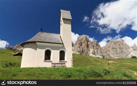 small chapel beneath Cir Dolomites in Gardena pass, Italy