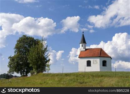 Small chapel in a meadow near the German village Steingaden. Chapel near Steingaden