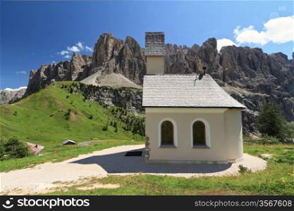 small chapel in Gardena pass, Italy. On background Sella mount