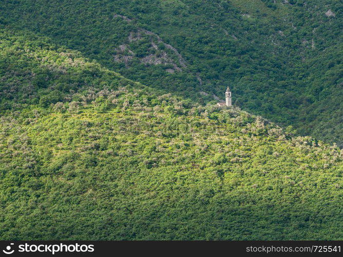 Small church on hillside of coastline of Gulf of Kotor in Montenegro. Cruise up the Bay of Kotor in Montenegro