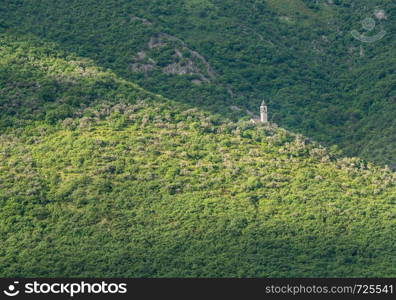 Small church on hillside of coastline of Gulf of Kotor in Montenegro. Cruise up the Bay of Kotor in Montenegro