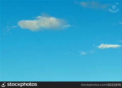 Small clouds decorating a beautirful blue sky