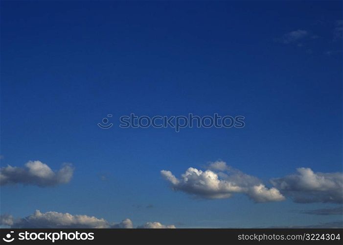 Small Clouds In A Blue Sky