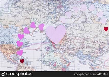 small colourful paper hearts world map