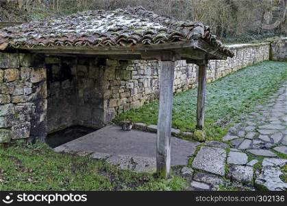Small corner with roof oven sacred spring source in Demir Baba Teke, cult monument honored by both Christians and Muslims in winter near Sveshtari village, Municipality Isperih, Razgrad District, Northeastern Bulgaria