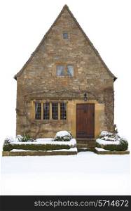 Small Cotswold cottage cut-out on white background, Broadway, Worcestershire, England.