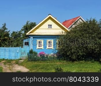 Small country wooden house, summer sunny day