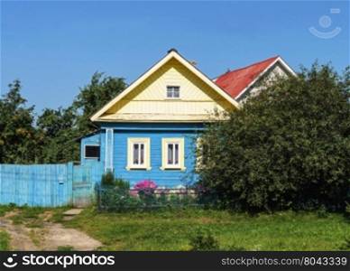 Small country wooden house, summer sunny day
