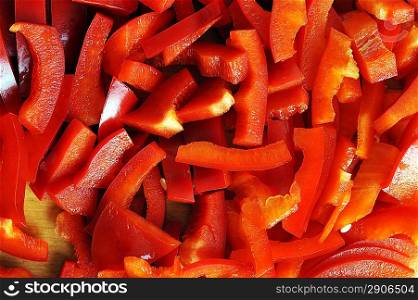 Small cut red sweet pepper on board