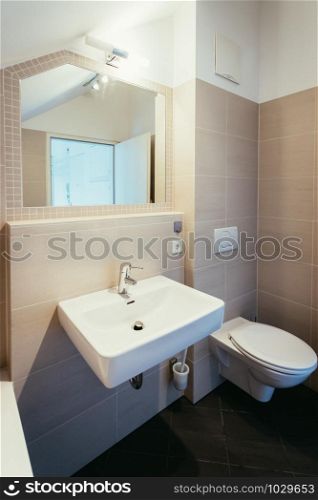 Small cute bathroom in an apartment, modern design