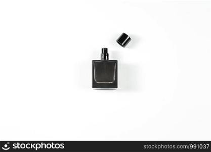 small dark perfume bottle on white isolated background