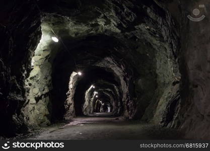 Small dark tunnel in a Swiss mountain