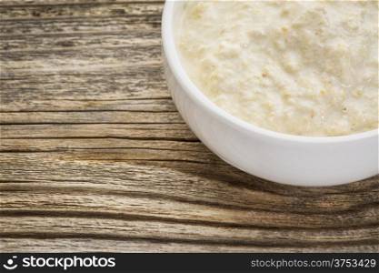 small dish of a traditional horseradish sauce with eggs on a grained wood