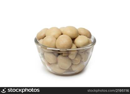 small dish of tasty canned sliced mushrooms isolated on white background. small dish of tasty canned sliced mushrooms.