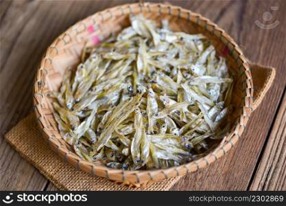 small dried fish on basket and the sack background