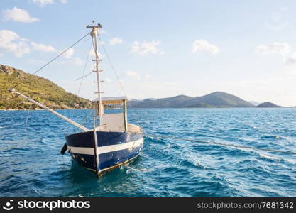 Small fishing boat  in harbor, Turkey