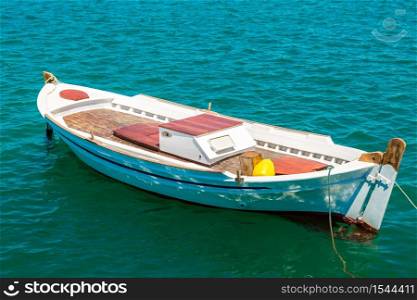 Small fishing boat on the sea in a summer day