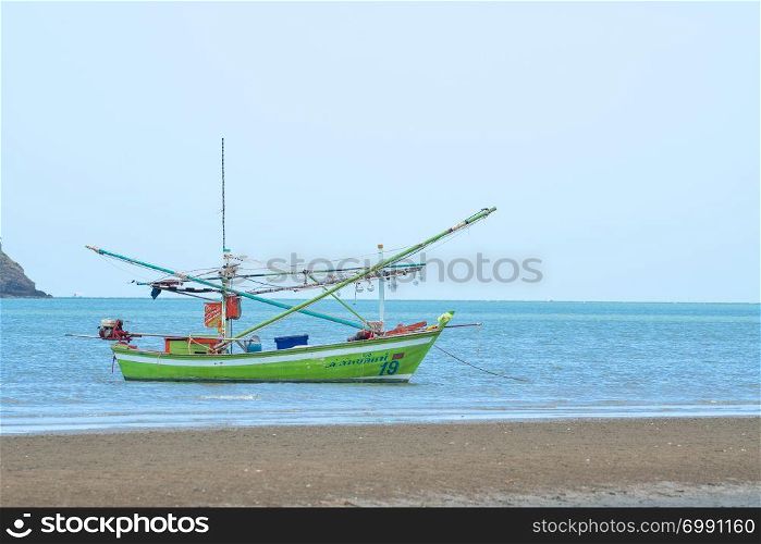 Small fishing boat Parked by the sea On the beach