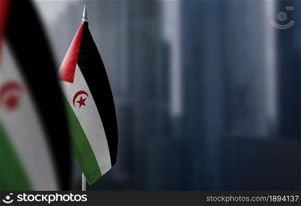 Small flags of Sahrawi on a blurry background of the city.. Small flags of Sahrawi on a blurry background of the city