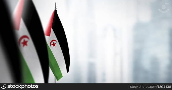 Small flags of Sahrawi on a blurry background of the city.. Small flags of Sahrawi on a blurry background of the city