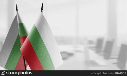Small flags of the Bulgaria on an abstract blurry background.. Small flags of the Bulgaria on an abstract blurry background