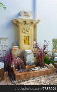 small fountain with a typical Andalusian patio plants